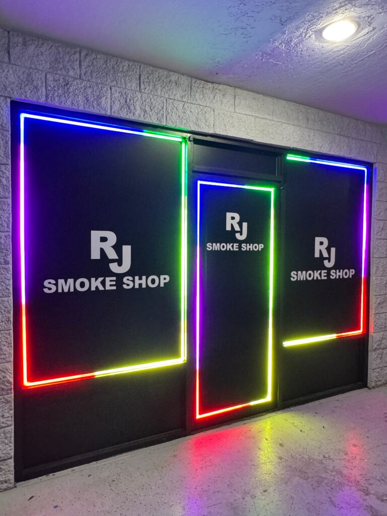 Color-changing LED outlines around storefront windows at night